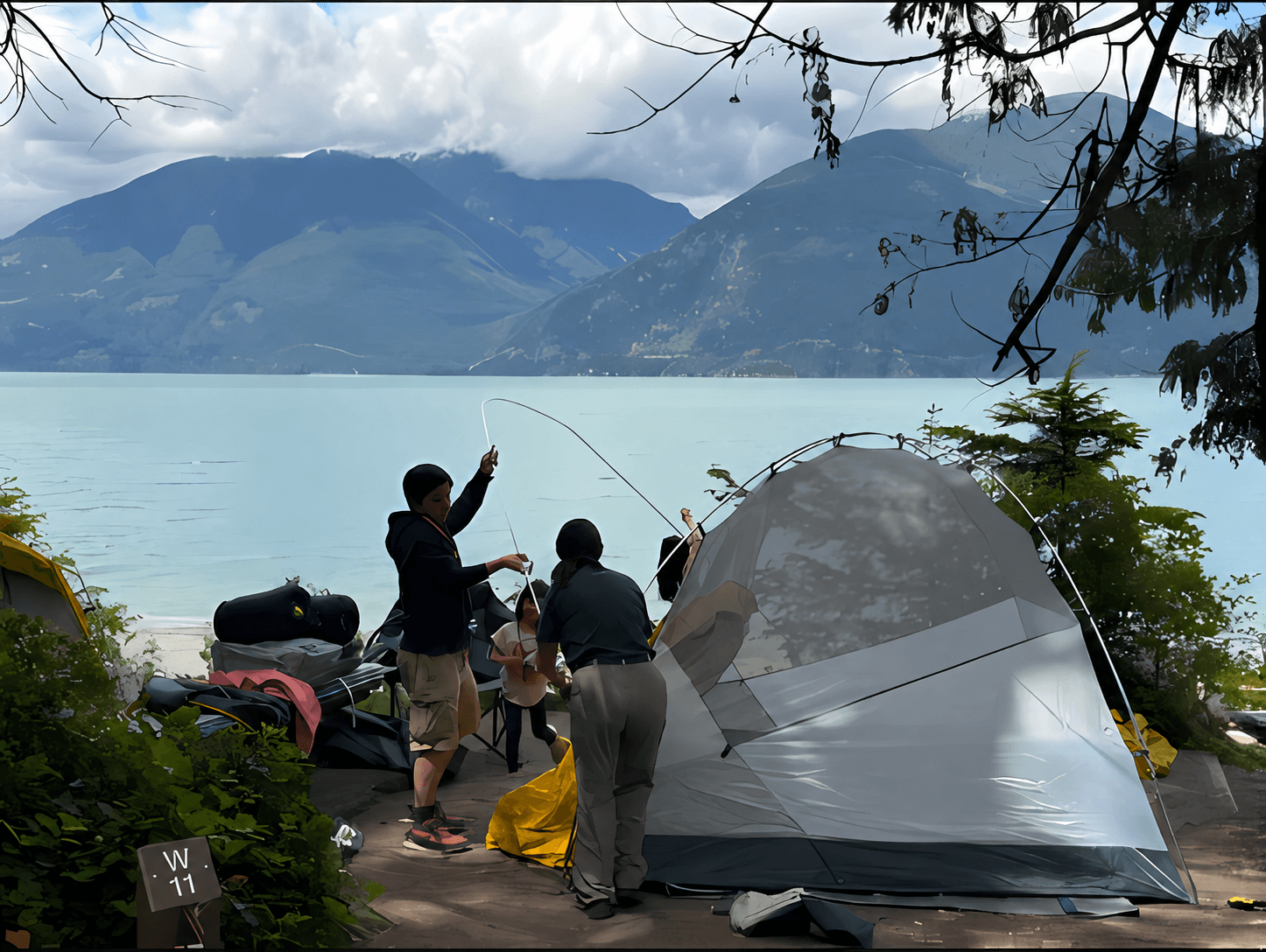 Family setting up camp beside a mountain lake.